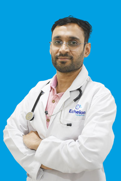 Male doctor with stethoscope in white coat, pink shirt, arms crossed against blue background.
