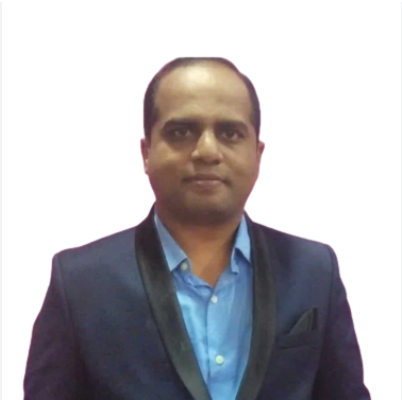 Picture1(29) Portrait of a man wearing a navy blazer with satin lapels and a light blue shirt, looking at the camera against a white background, neutral expression.