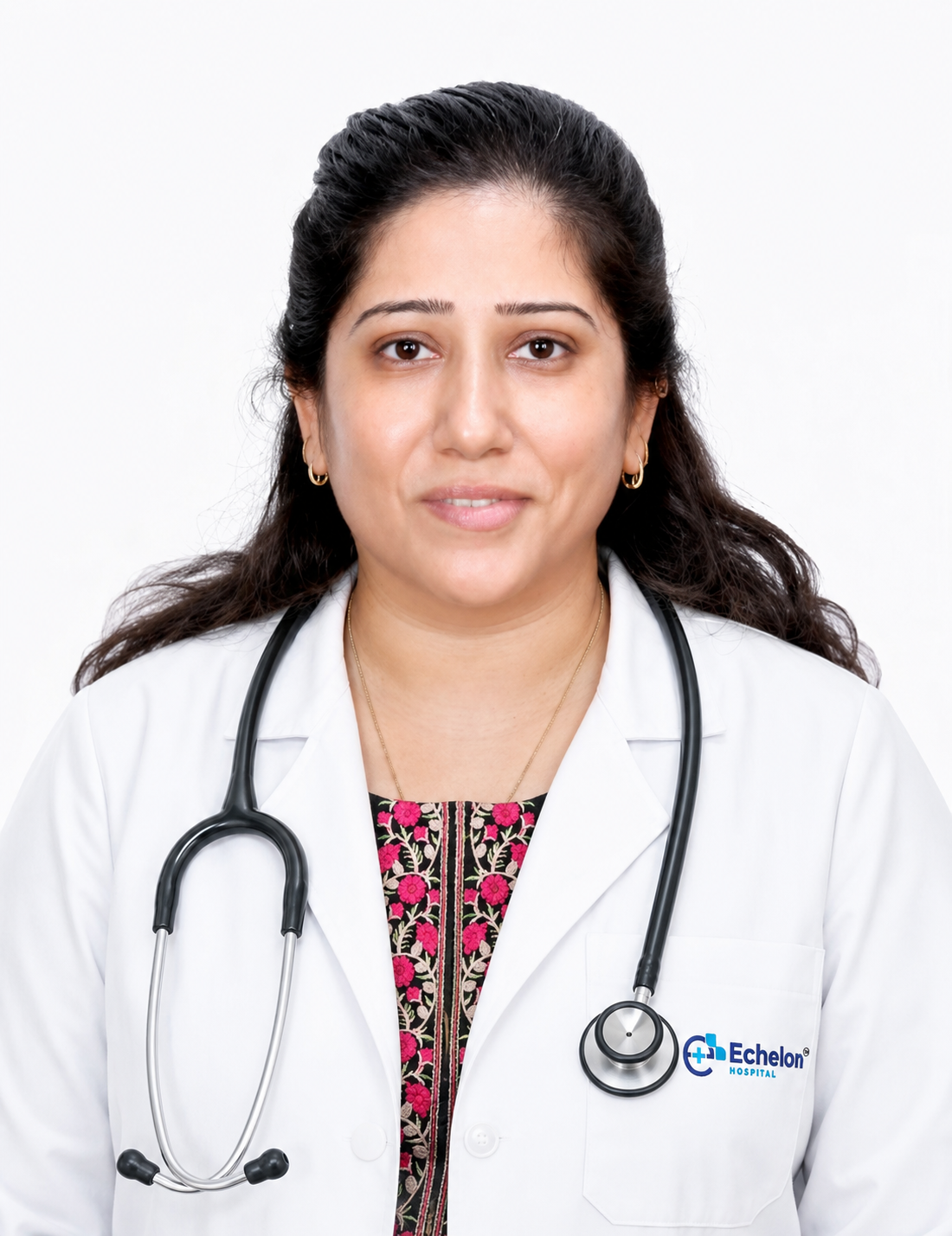 Portrait of a female doctor in a white coat with a stethoscope around her neck, smiling, Echelon Hospital logo on the pocket.
