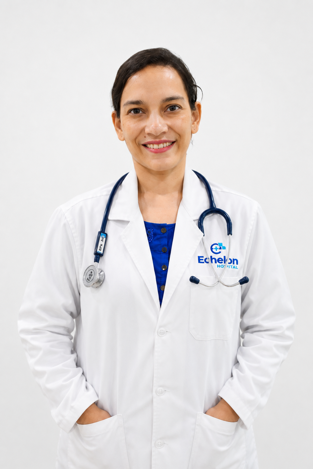 Smiling female doctor in a white coat with a stethoscope around her neck, standing against a white background.