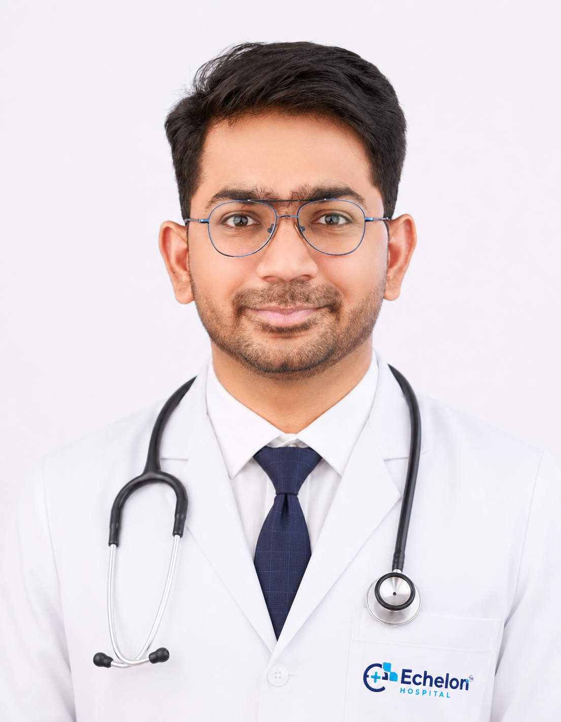 Portrait of a doctor in a white coat with a stethoscope around the neck, smiling at the camera; hospital logo on the chest pocket.