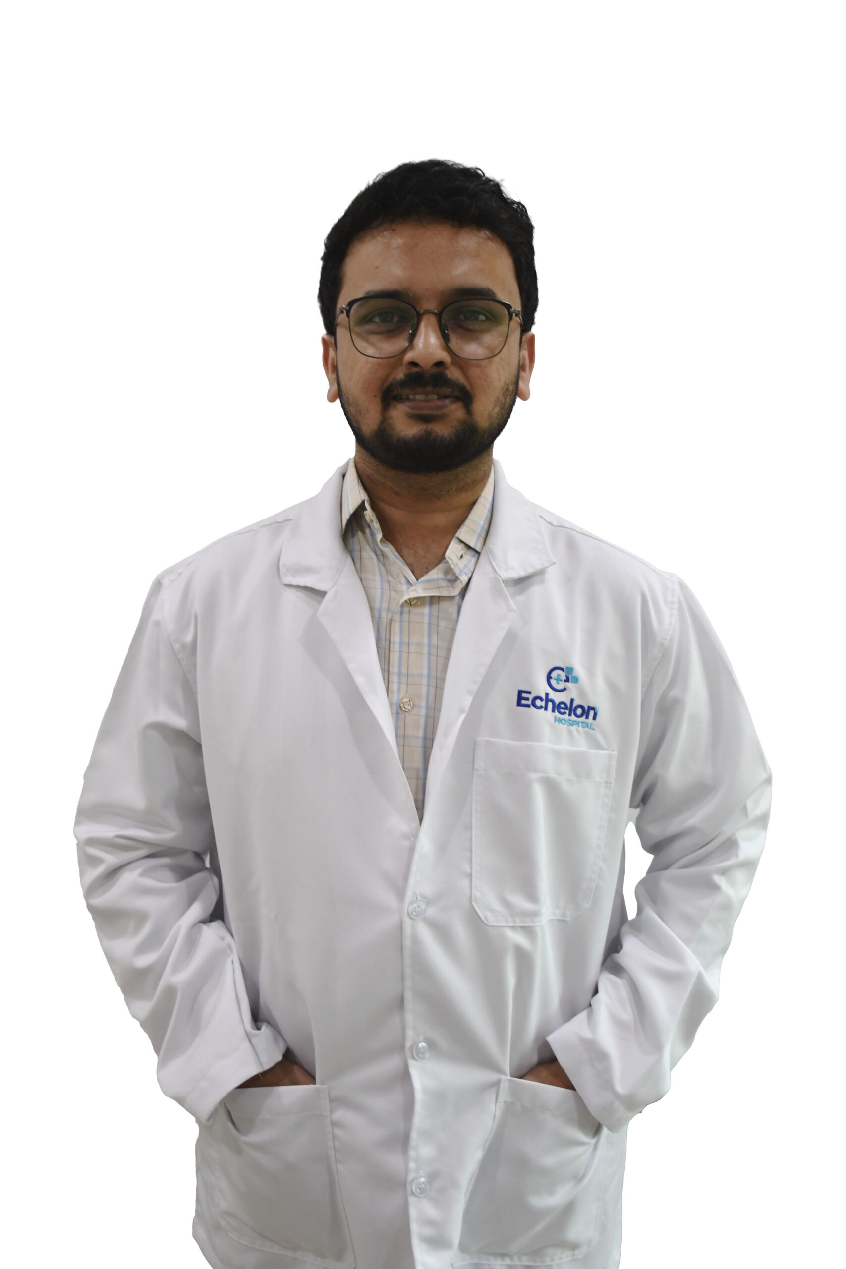 Male healthcare professional in a white lab coat with Echelon Hospital logo, standing with hands in pockets.