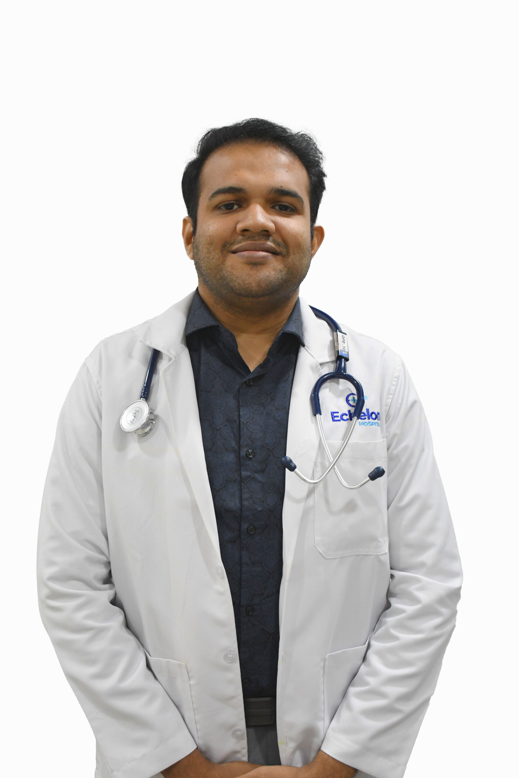 Male doctor in a white lab coat with a stethoscope around his neck, posing against a white background.
