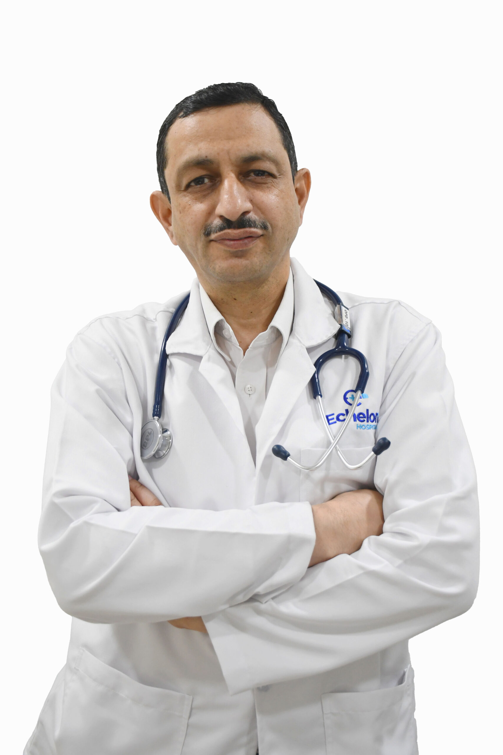 Male doctor in a white coat with a stethoscope around his neck, arms folded, looking at the camera.