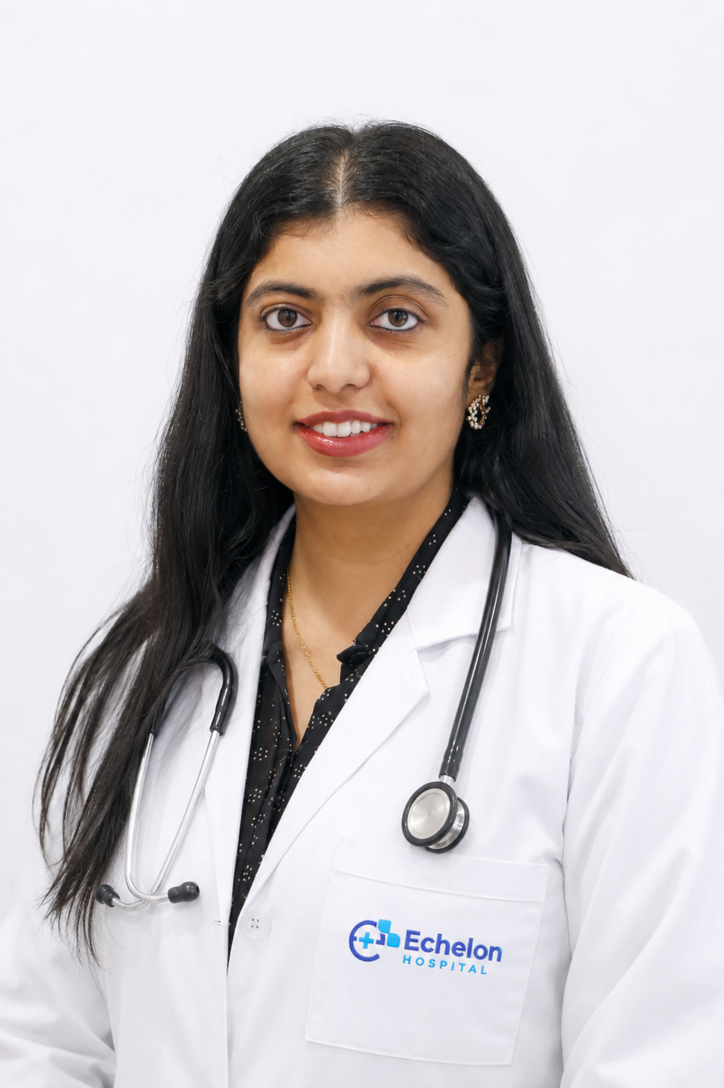 Female doctor wearing a white coat with a stethoscope around her neck, Echelon Hospital logo on the pocket.